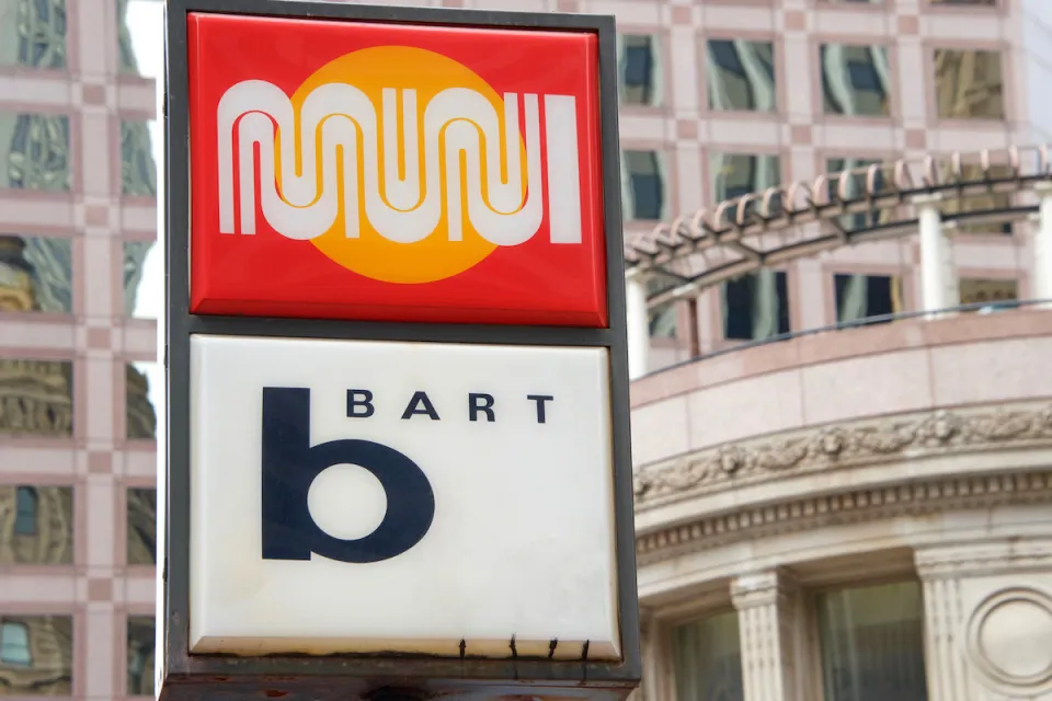 Close-up of sign at outdoor transit station for MUNI and BART in San Francisco, California.